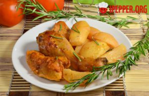 Chicken meat in a marinade with potatoes in the oven
