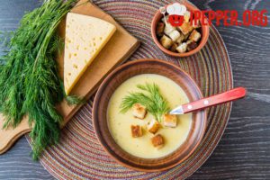 Cheese cream soup with melted and hard cheese