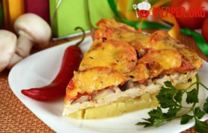 Casserole of potatoes, meat, mushrooms and tomatoes
