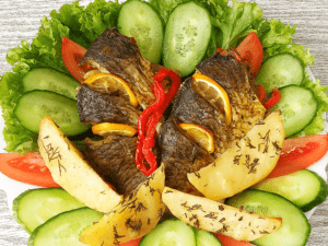Baked carp with vegetables