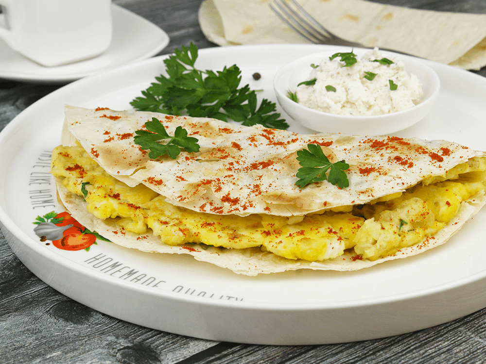Omelet with curd cheese and herbs in lavash