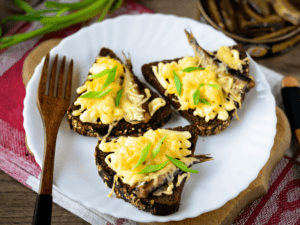 Hot sandwiches with sprats and cheese in the oven