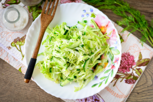 Diet salad with young cabbage and cucumbers