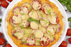 Pizza in a pan with sausage and cheese