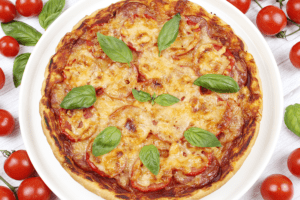Pizza with sausage, cheese and tomatoes