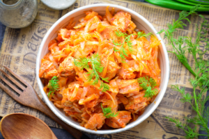 Stewed cabbage with meat in a frying pan